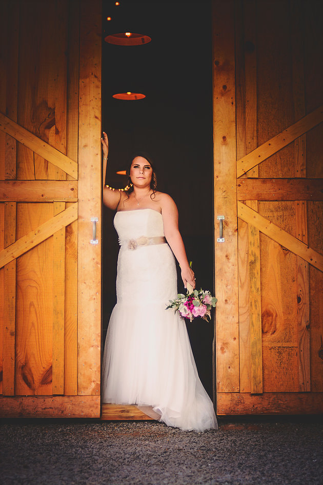 Barn wedding venue bridal portrait with chandelier