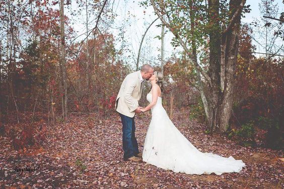 Bride and groom at farm wedding venue in Fall