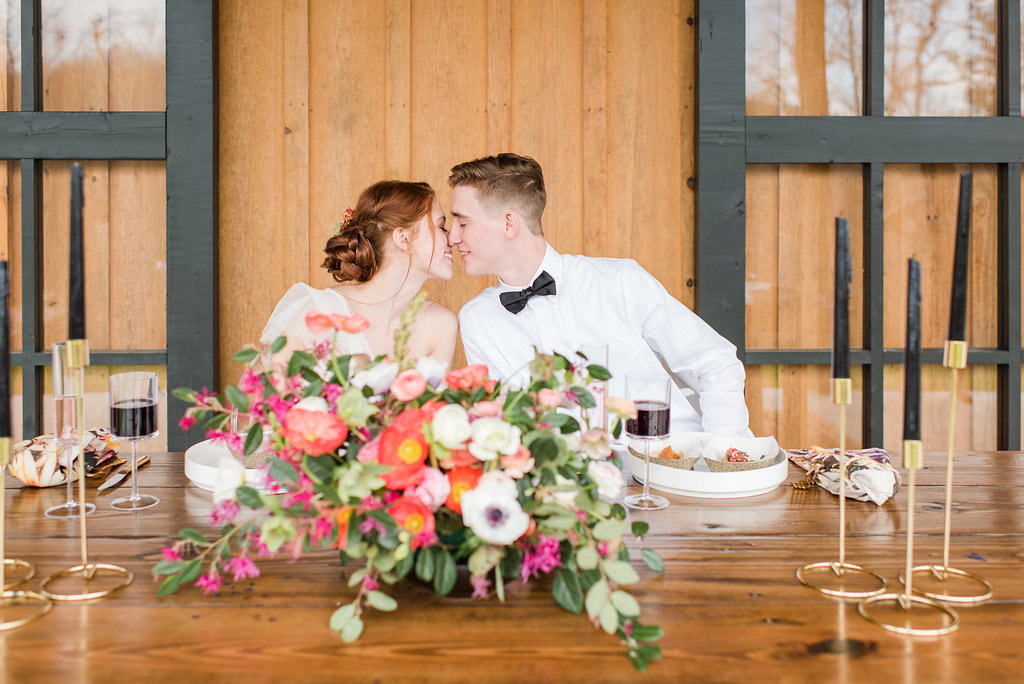 Bride and groom kiss at farm wedding venue in Georgia