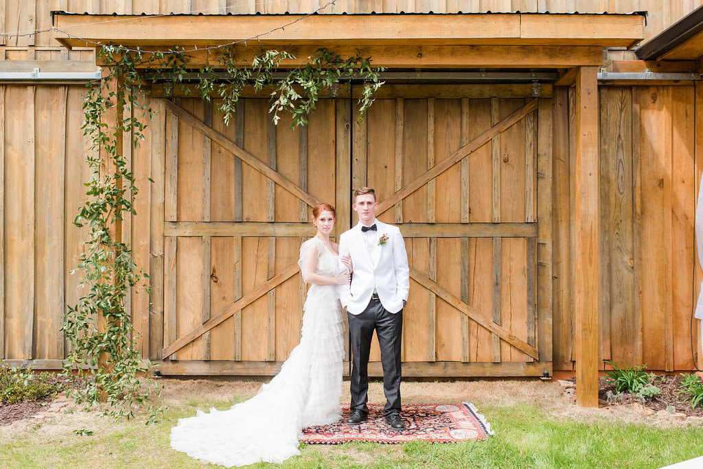 Bride and Groom in front of barn doors in North Georgia