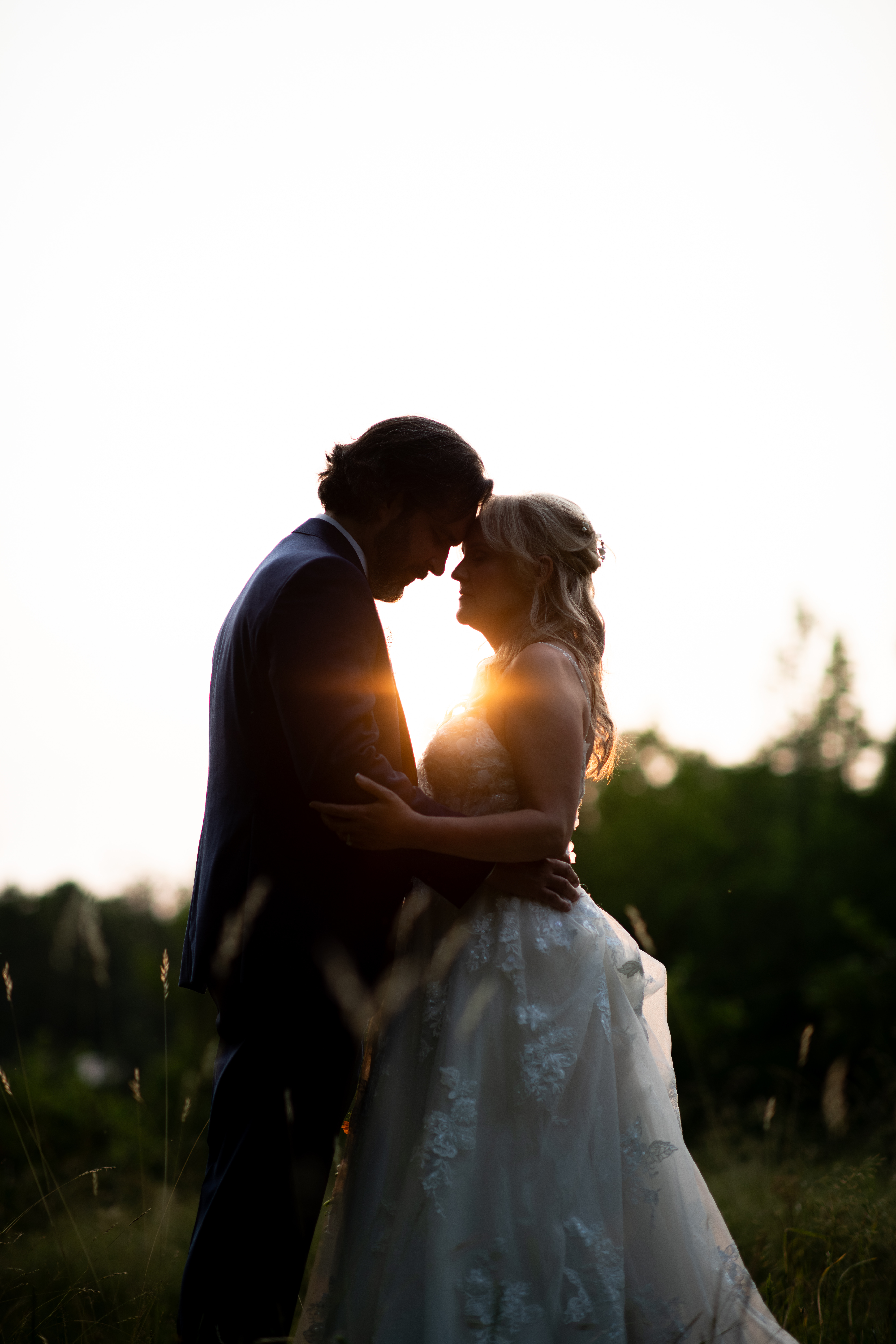 A bride and groom in a memorable moment at sunset